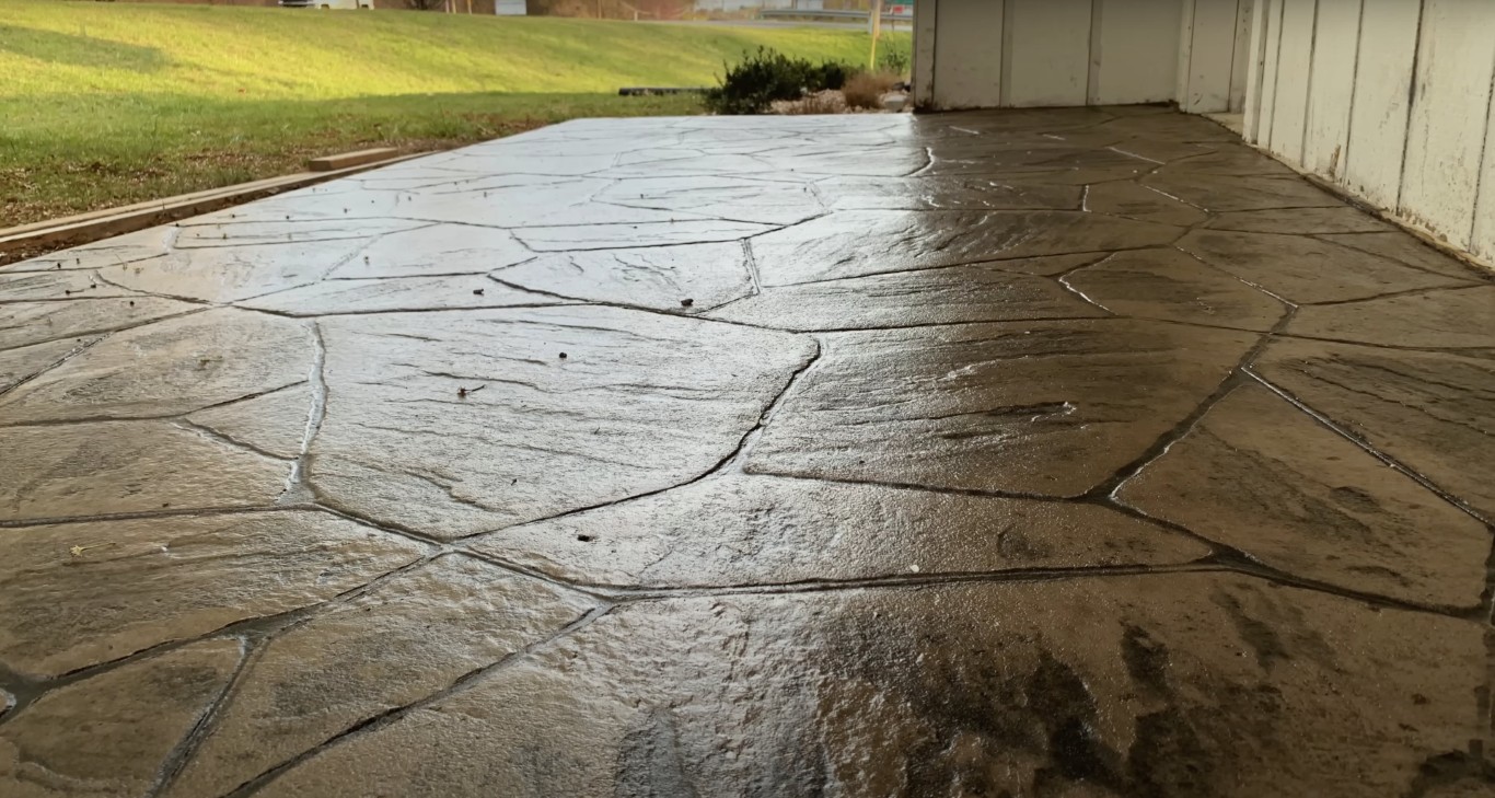 Stamped decorative concrete driveway with natural stone pattern finish